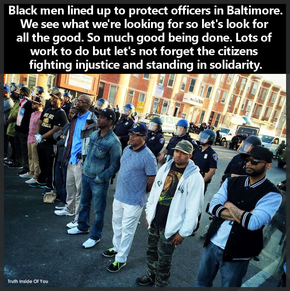 Black men lined up to protect officers in Baltimore.