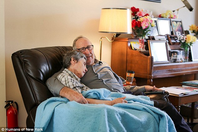 elderly man with his wife, she has Alzheimer's