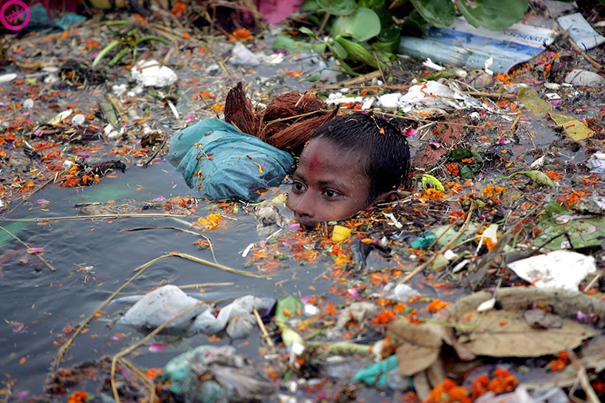 Boy Swimming In Polluted Water