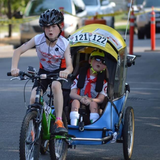 17. This boy finished a mini-triathlon together with his disabled brother.