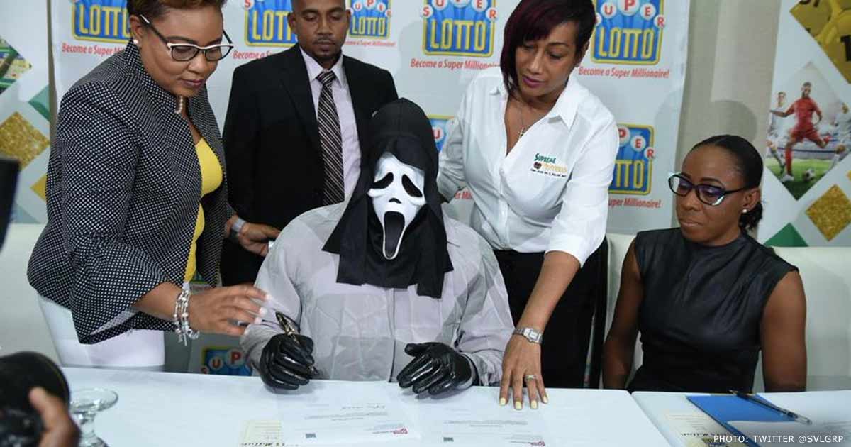 Lottery winner collects prize in a ‘Scream’ mask